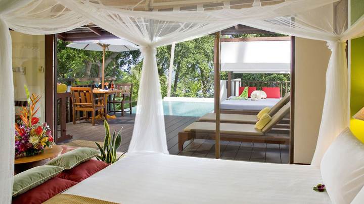 White Bed And Curtain In Bedroom And Pool Outside